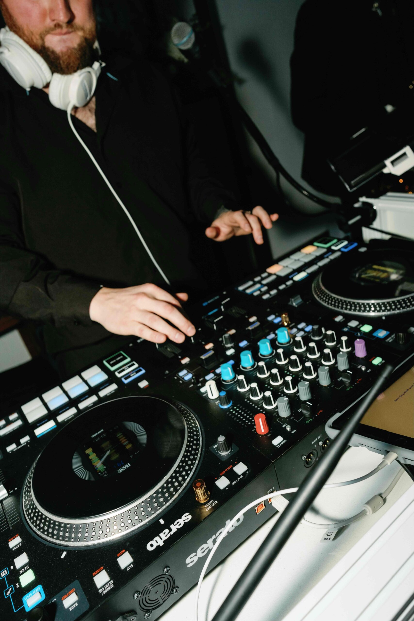 DJ mixing music on turntables at a wedding Reception